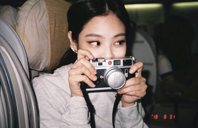Jennie holding a camera
